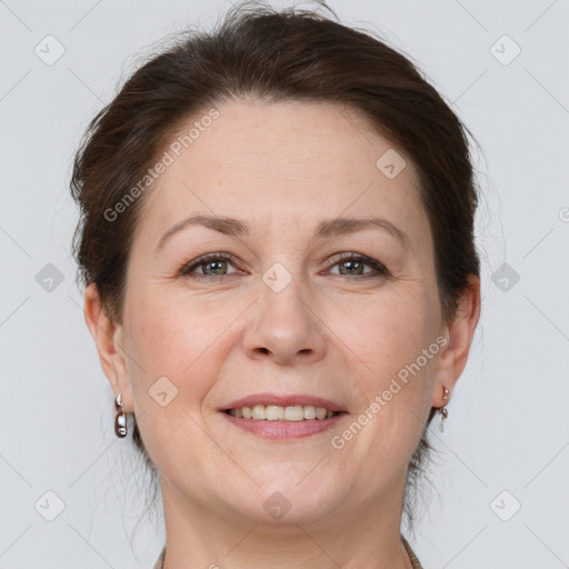 Joyful white adult female with short  brown hair and grey eyes