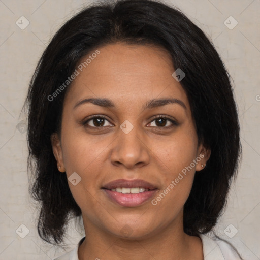 Joyful latino adult female with medium  brown hair and brown eyes