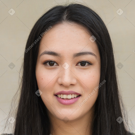 Joyful asian young-adult female with long  brown hair and brown eyes