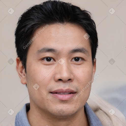 Joyful asian young-adult male with short  black hair and brown eyes