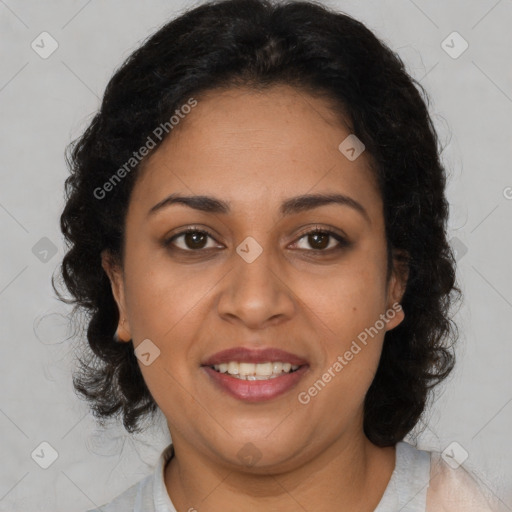 Joyful latino adult female with medium  brown hair and brown eyes