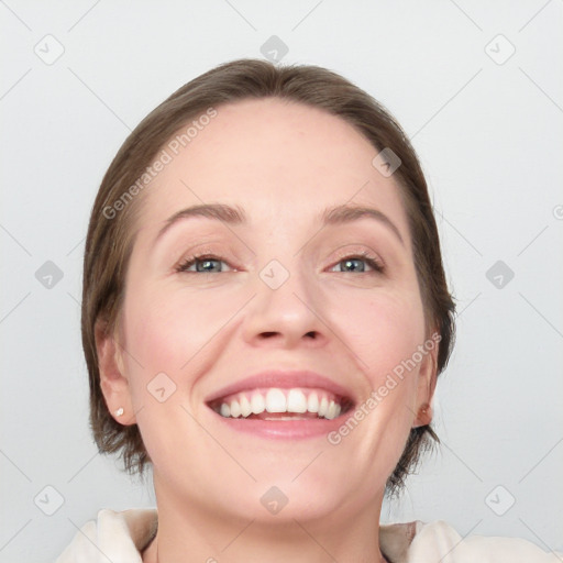 Joyful white young-adult female with medium  brown hair and blue eyes