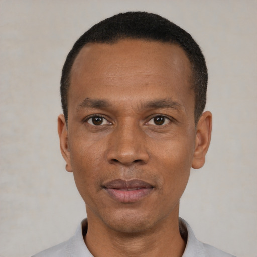 Neutral black adult male with short  black hair and brown eyes