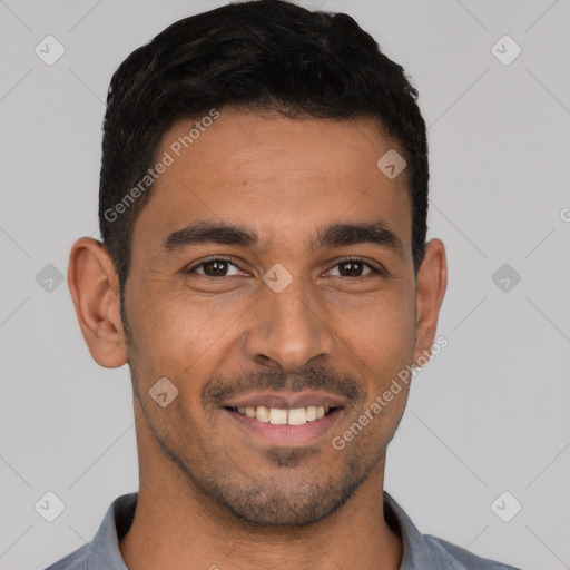 Joyful latino young-adult male with short  black hair and brown eyes