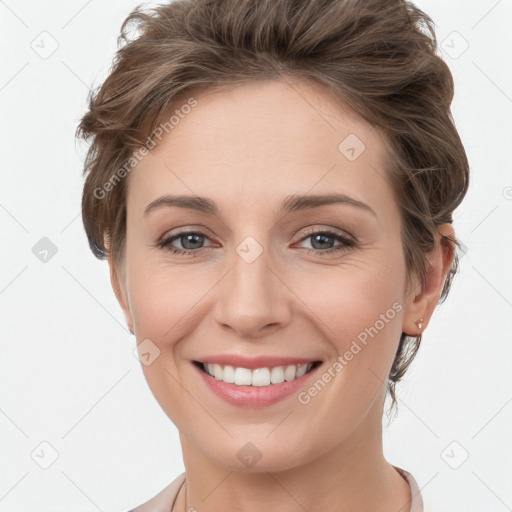 Joyful white young-adult female with short  brown hair and grey eyes