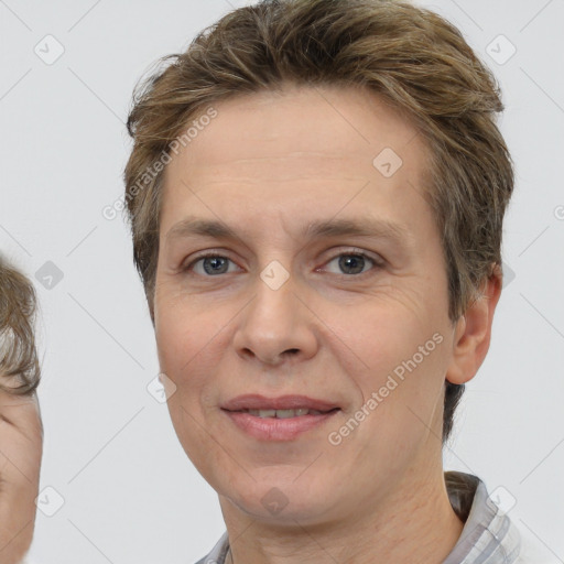 Joyful white adult female with short  brown hair and brown eyes