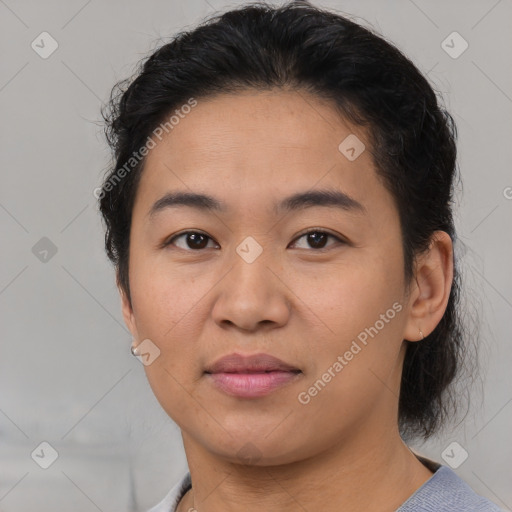 Joyful latino young-adult female with short  brown hair and brown eyes