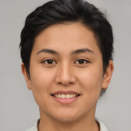 Joyful asian young-adult female with short  brown hair and brown eyes