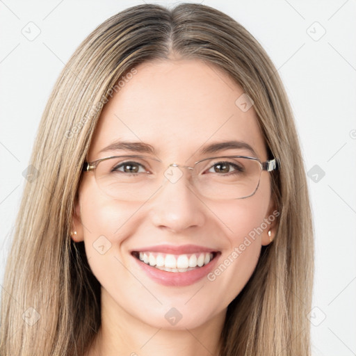 Joyful white young-adult female with long  brown hair and green eyes