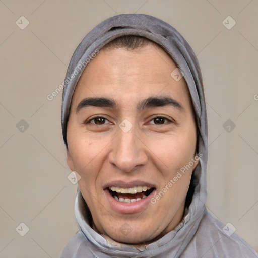 Joyful white adult male with short  black hair and brown eyes