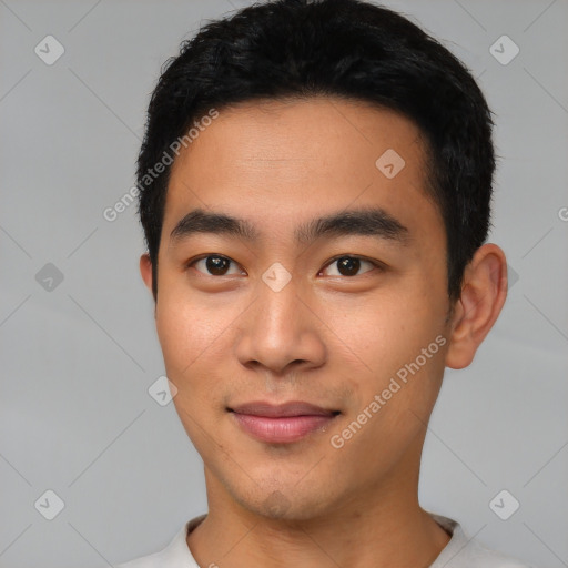 Joyful latino young-adult male with short  black hair and brown eyes