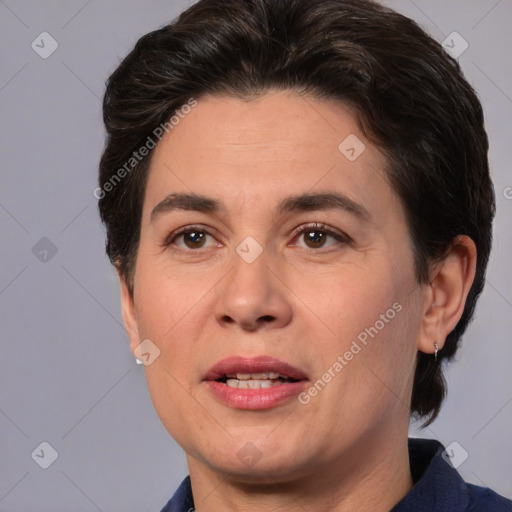 Joyful white adult female with medium  brown hair and brown eyes