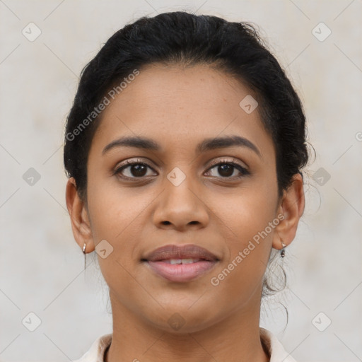 Joyful latino young-adult female with short  brown hair and brown eyes