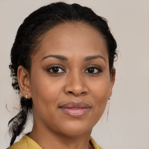 Joyful black young-adult female with medium  brown hair and brown eyes