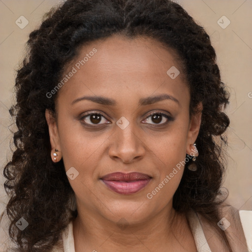 Joyful black young-adult female with long  brown hair and brown eyes