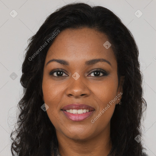 Joyful black young-adult female with long  brown hair and brown eyes