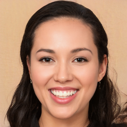 Joyful white young-adult female with long  black hair and brown eyes