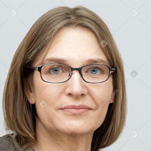 Joyful white adult female with medium  brown hair and blue eyes