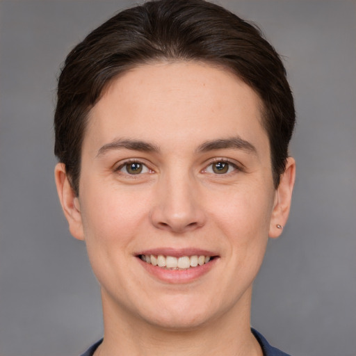 Joyful white young-adult female with short  brown hair and brown eyes