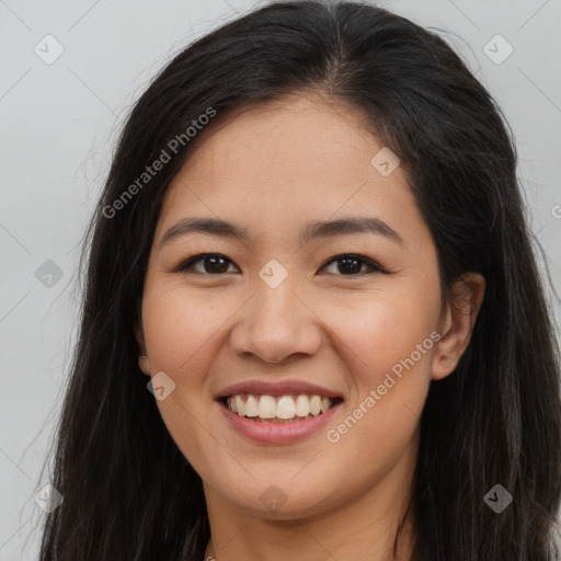 Joyful asian young-adult female with long  brown hair and brown eyes