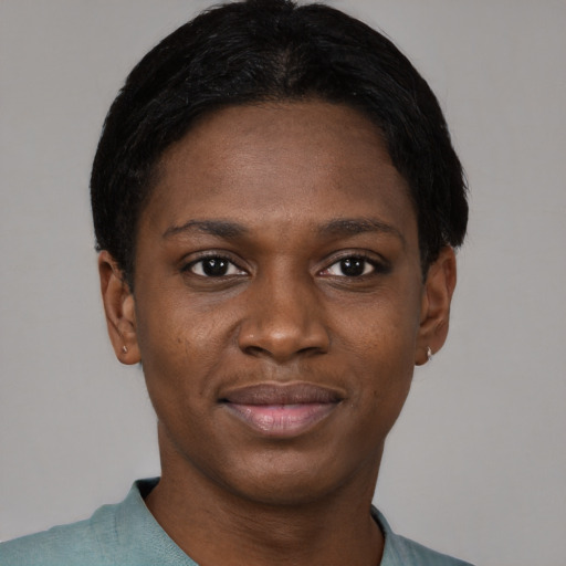 Joyful black young-adult female with short  black hair and brown eyes
