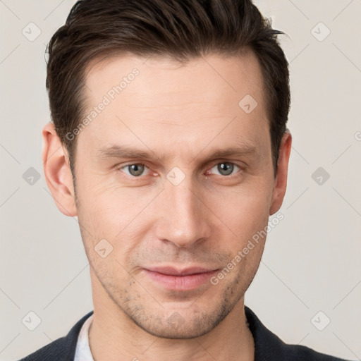 Joyful white young-adult male with short  brown hair and grey eyes