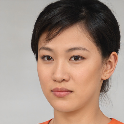 Neutral asian young-adult female with medium  brown hair and brown eyes