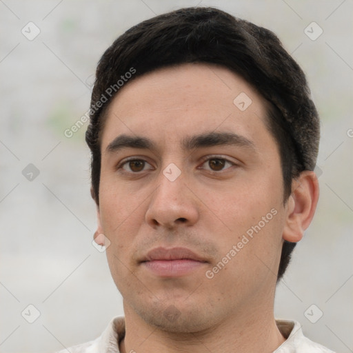 Neutral white young-adult male with short  black hair and brown eyes