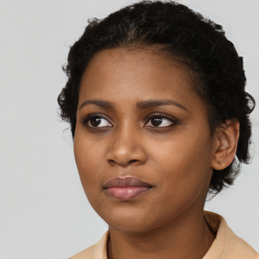 Neutral black young-adult female with short  black hair and brown eyes