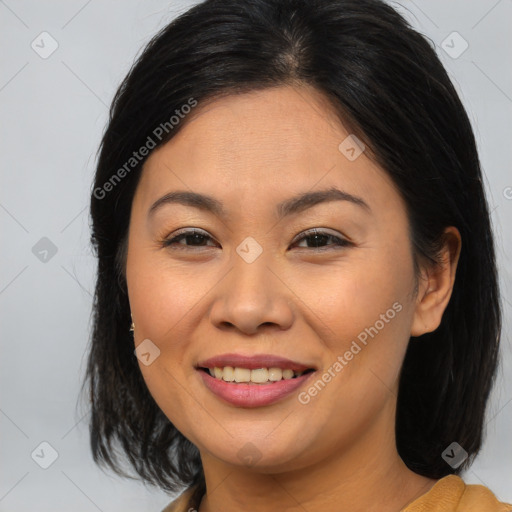 Joyful asian young-adult female with medium  brown hair and brown eyes