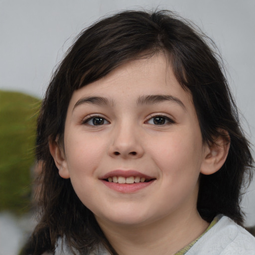 Joyful white child female with medium  brown hair and brown eyes