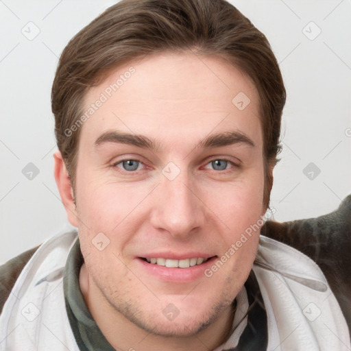 Joyful white young-adult male with short  brown hair and grey eyes