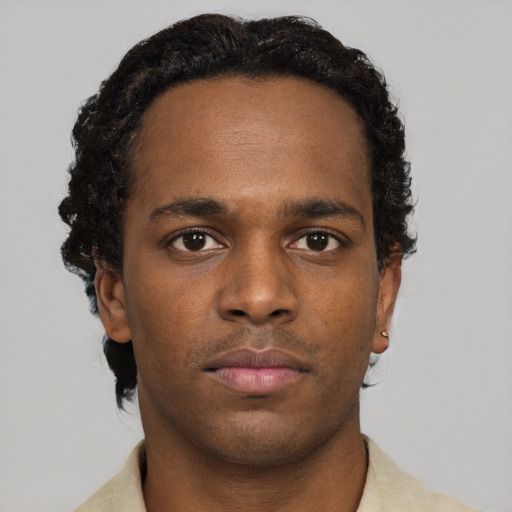 Neutral black young-adult male with short  brown hair and brown eyes
