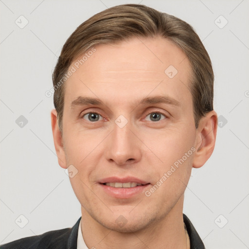 Joyful white adult male with short  brown hair and grey eyes