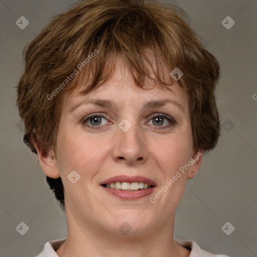 Joyful white adult female with short  brown hair and grey eyes