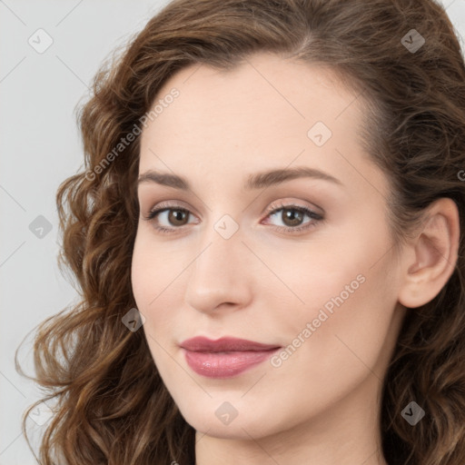 Joyful white young-adult female with long  brown hair and green eyes