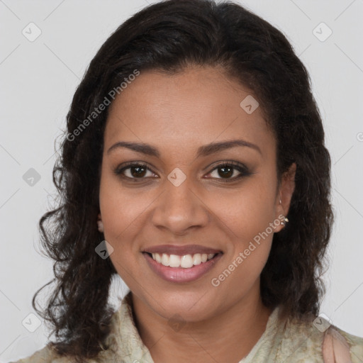 Joyful black young-adult female with long  brown hair and brown eyes