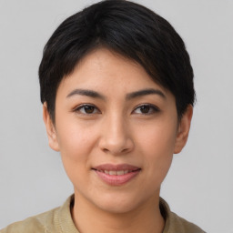 Joyful asian young-adult female with short  brown hair and brown eyes