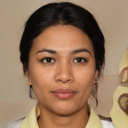 Joyful latino young-adult female with medium  brown hair and brown eyes