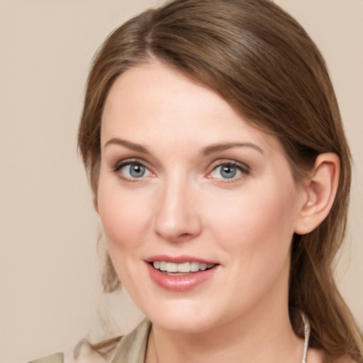 Joyful white young-adult female with medium  brown hair and grey eyes