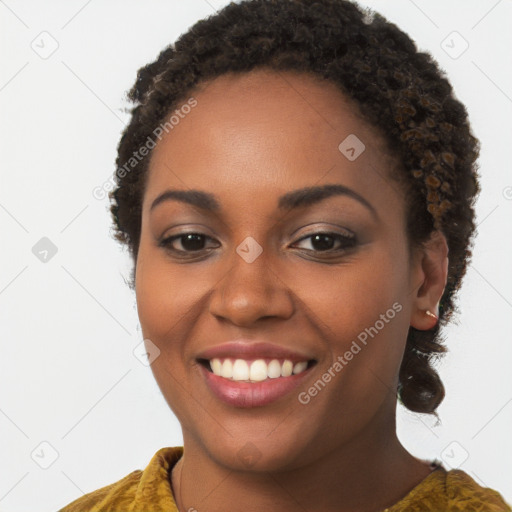 Joyful black young-adult female with long  brown hair and brown eyes