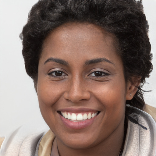 Joyful white young-adult female with long  brown hair and brown eyes