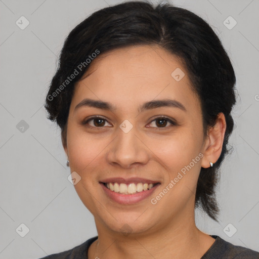 Joyful latino young-adult female with medium  black hair and brown eyes