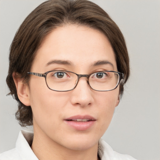 Joyful white young-adult female with medium  brown hair and green eyes