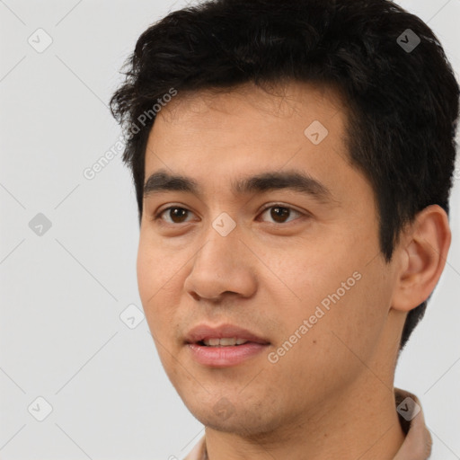 Joyful white young-adult male with short  black hair and brown eyes