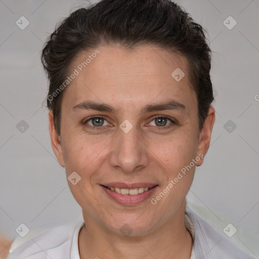 Joyful white adult female with short  brown hair and brown eyes