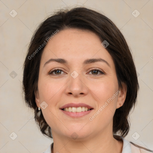 Joyful white adult female with medium  brown hair and brown eyes