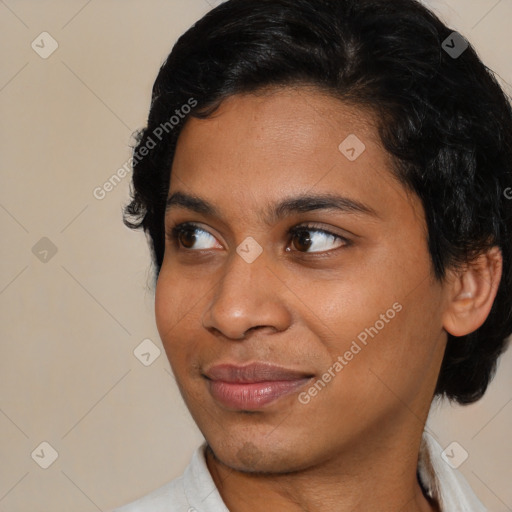 Joyful black young-adult female with medium  black hair and brown eyes