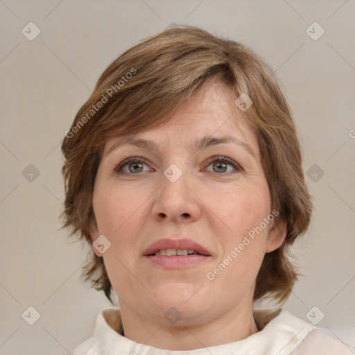 Joyful white adult female with medium  brown hair and blue eyes