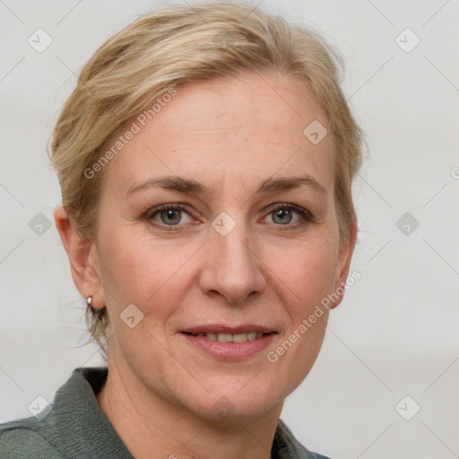 Joyful white adult female with medium  brown hair and blue eyes